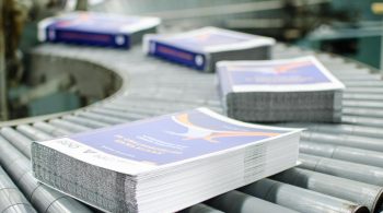 printed-stack-of-papers-on-factory-machine