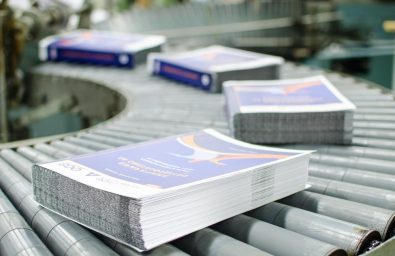 printed-stack-of-papers-on-factory-machine printed-stack-of-papers-on-factory-machine